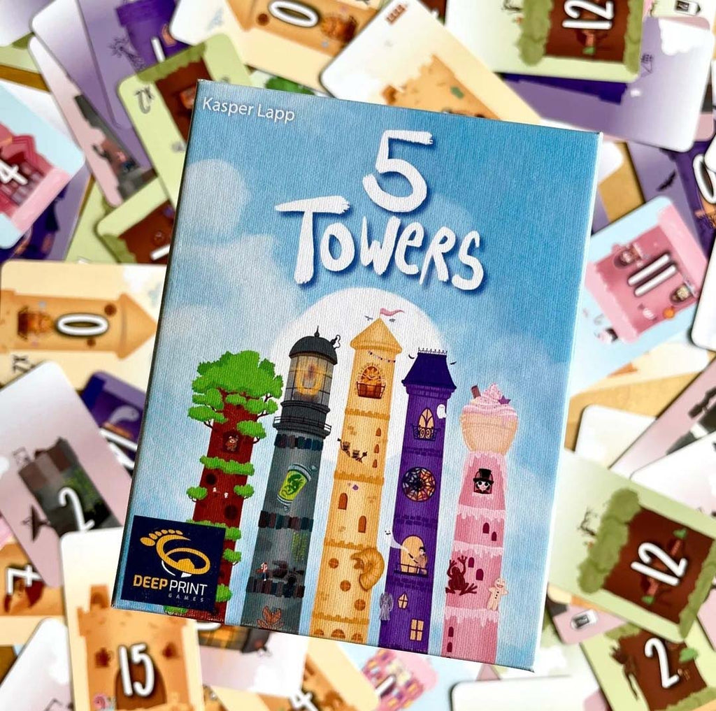 top down close up of 5 towers cover with cards in blury background