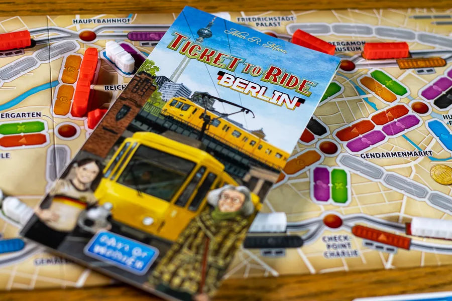 ticket to ride berlin, game instructions cover on a city map board