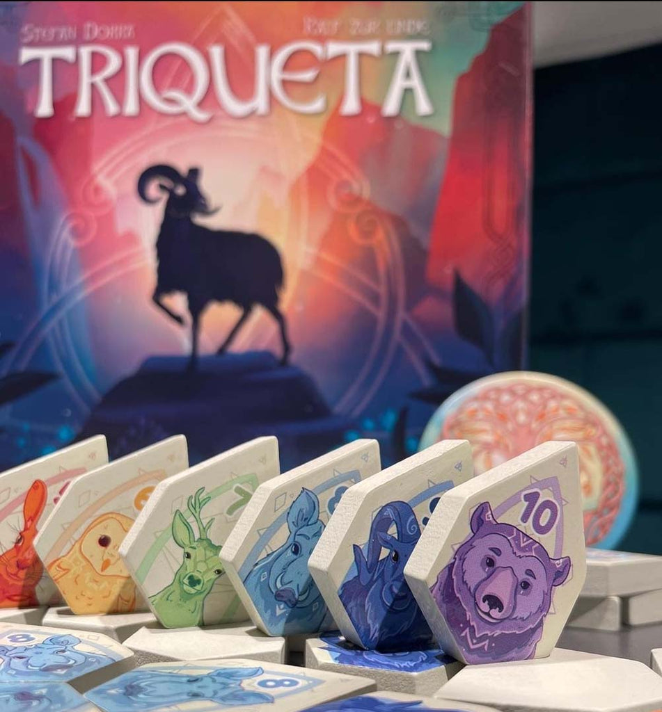 beautiful triqueta tiles in fron of abstract family game cover in the background