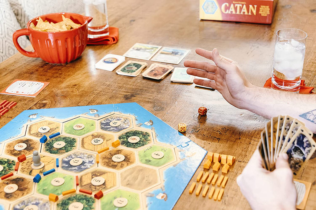 rolling dice in catan board game