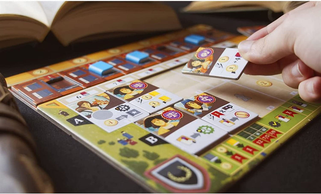 Eggertspiele Alma Mater board game player laying a character tile