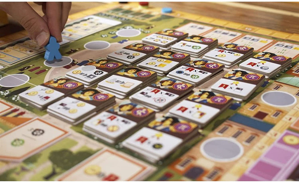 Eggertspiele Alma Mater board game gameplay in action player moving a meeple