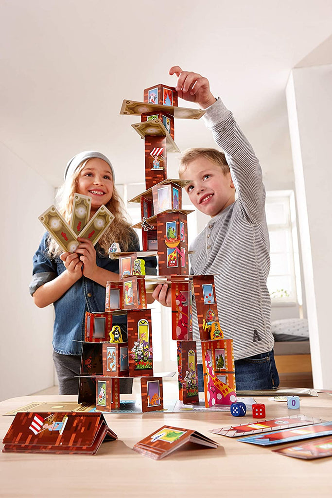 boy and girl having fun playing haba rhino hero super battle board game