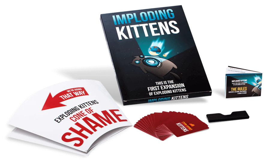 Exploding Kittens Imploding Kittens card game expansion contents displayed with cards rulebook and cone of shame