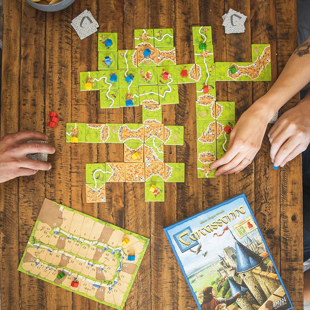 four player gameplay of a board game carcassonne
