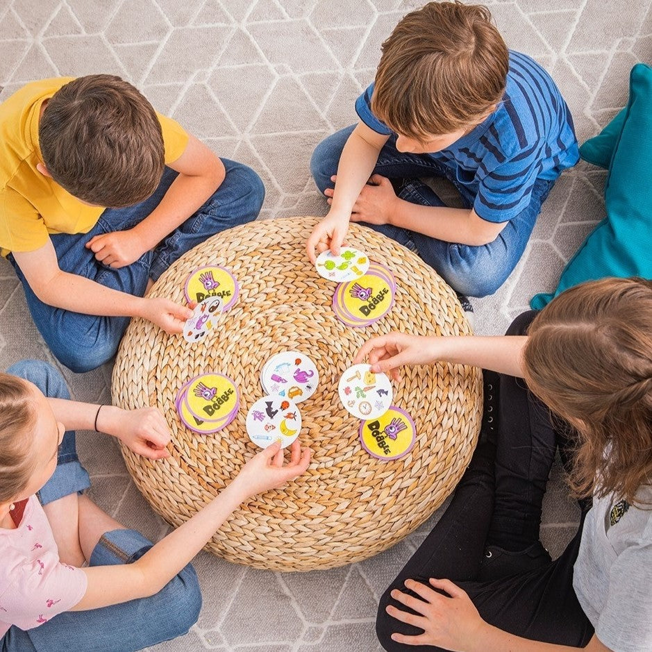 boys and girls playing dobble card game