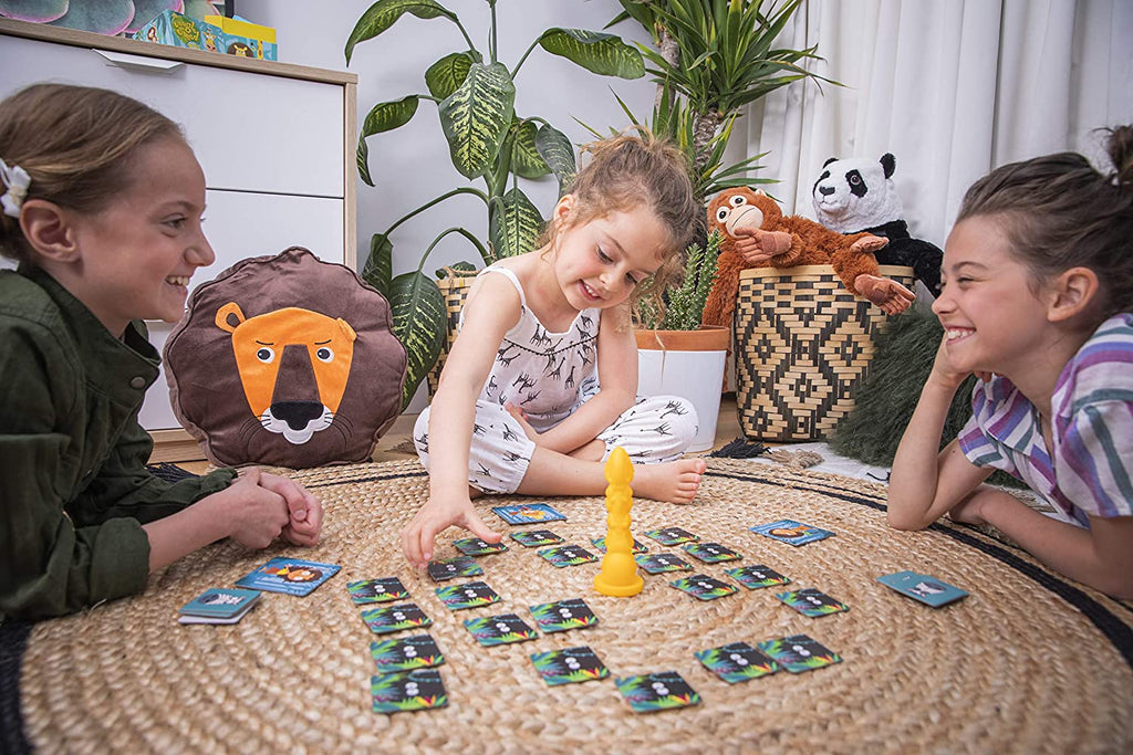 Children friends playing Zygomatic Jungle Speed Kids card game